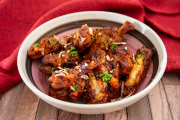delicious fried chicken wings with sauce