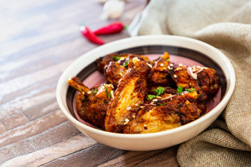 delicious fried chicken wings with sauce