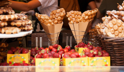 egg bubble waffles wrapped by brown paper in a basket as street food