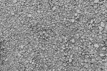 Background with gravel texture and pieces of stone in gray color