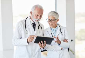 doctor senior conversation hospital health care medicine
