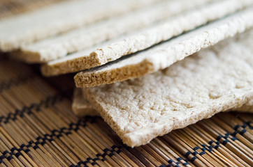Crispy bread on the table napkin close up. Healthy snack and vegetarian food.