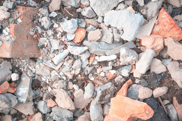 Broken building bricks. Types of concrete debris. Ruins of industrial buildings. Top view.