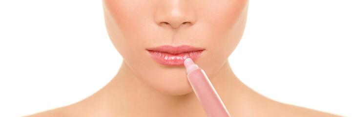 Lips banner beauty woman applying lip gloss moisturizer balm panorama