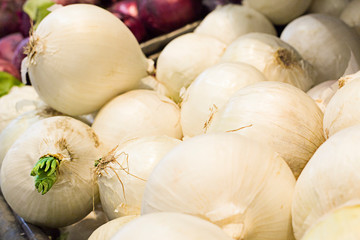 Fresh onions in supermarket. Concept of healthy food, bio, vegetarian, diet.