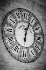 Black & white old and vintage clock on wall