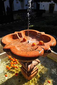 Beautiful marble fountain in Plaza de Do&ntilde;a Elvira at the famous Santa Cruz neighborhood of Seville, Andalusia, Spain