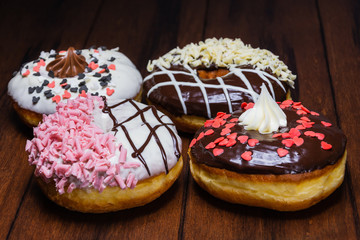 chocolate cake with cream on wooden table