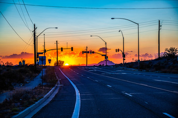 sun setting on a Mesa Arizona highway.