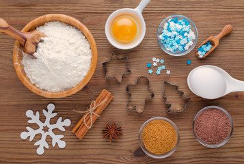 Fototapeta na wymiar ingredients and kitchen tools for dessert baking on wooden background