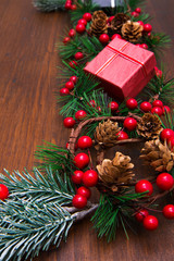 Fototapeta na wymiar beautiful christmas decoration with fir branches on wood
