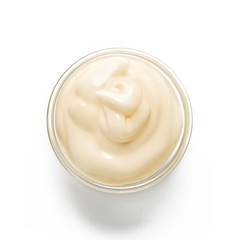 Delicious spicy mayonnaise in a glass bowl on a white background