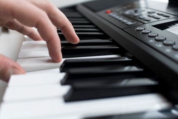 Close-up photo of pianist, hands on musical modern electronic synthesizer and keys. Music modern...
