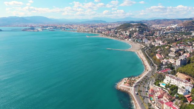 Drone shot - 4K - Aerial view of M&aacute;laga (Spain) city of Costa del Sol with the beach and buildings in a sunny day