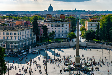 High angle view of Piazza del Popolo visited by tourists as seen from Terrazza del Pincio in Villa Borghese gardens.