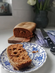 slice of fresh baked  ginger bread knife