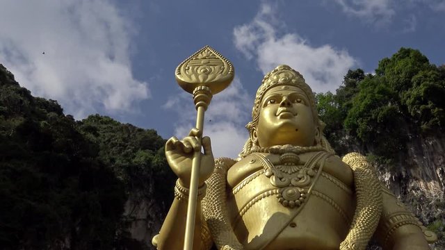 4K, The Lord Murugan Statue at entrance of Batu Caves in Malaysia. A limestone located at north of Kuala Lumpur. Temples Hindu. One of the most popular Tamil shrines outside India-Dan