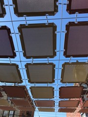 Looking Up At An Awning Over A Patio in Downtown