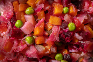 Traditional Russian salad vinaigrette watered with oil, christmas menu.