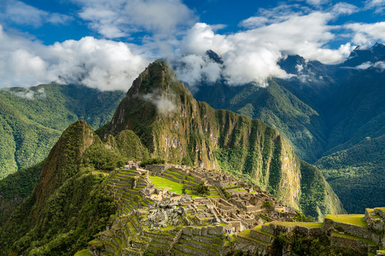 Historic ancient archeological Incan Machu Picchu on mountain in Andes, Cuzco Region, Peru