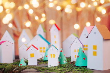 Christmas advent calendar of paper houses with garland lights