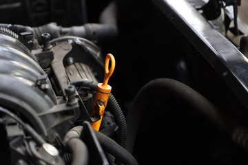 car engine close-up, oil dipstick