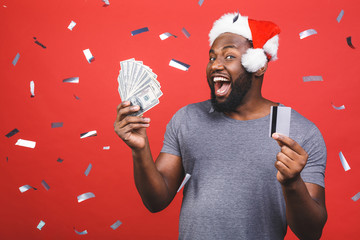 New year and black friday sale! Amazed screaming black african american man in christmas hat...