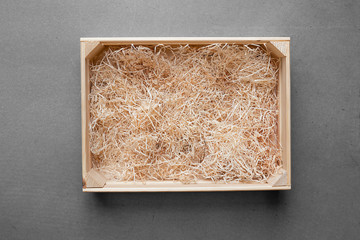 wooden box with hay - obrazy, fototapety, plakaty