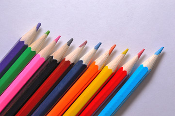 multicolored pencils on a light background