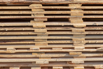 Set of stacked wood pine timber for construction. Stack of wood planks for furniture materials. Wood timber