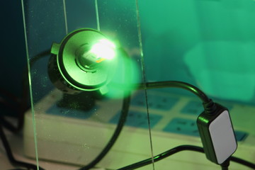 Lighting green headlight car lamp with DC driver close up, Automotive electric parts