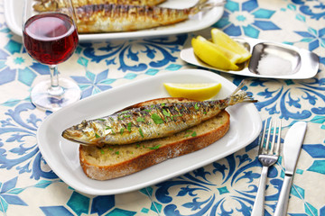 sardinas assadas, portuguese grilled sardines on toasted bread