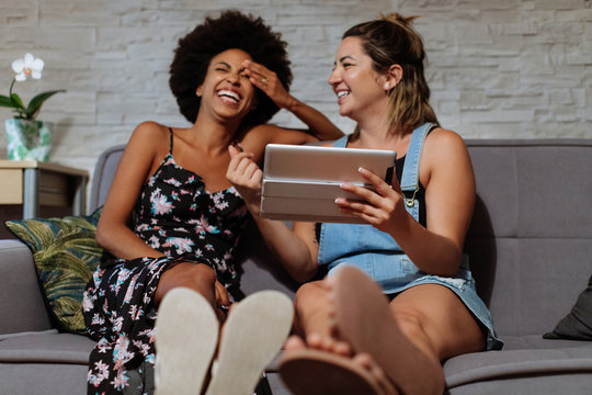 Two women looking at the tablet