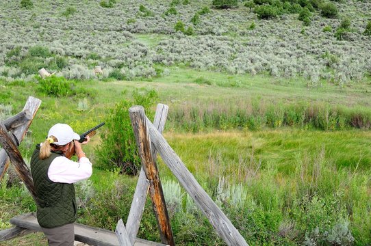 Cathy Beck shooting clay birds while visiting Colorado