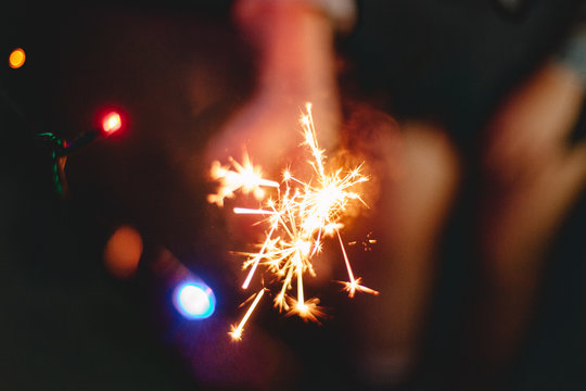 Person holding sparkler