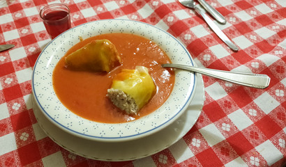 Deep plate filled with hungarian stuffed peppers (