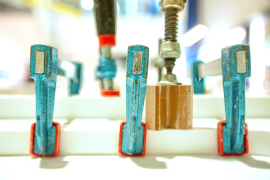Clamps on laminate wood with epoxy for boat parts