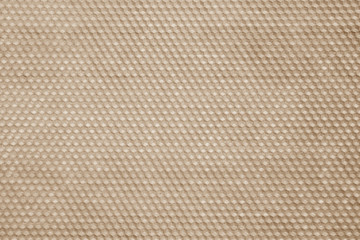 Honeycomb wax texture in brown tone.