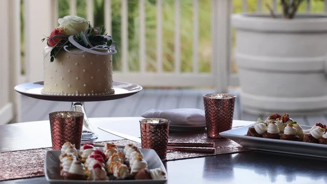 wedding cake stand on table with a white tablecloth 4K