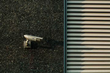 video surveillance camera in the city on the wall
