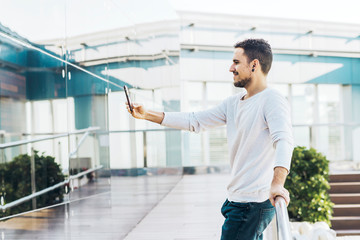 Smiling young bearded man a selfie in the city at Spain- Barcelona