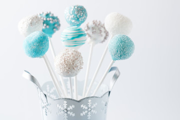 Blue and white cake pop bouquet.