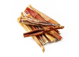 a group of natural dog teeth cleaning bully sticks on white background