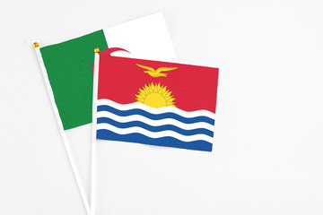 Kiribati and Algeria stick flags on white background. High quality fabric, miniature national flag....