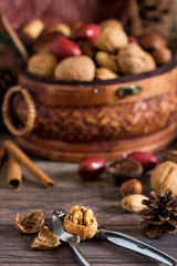 Heaping basket of mixed nuts and cracker.