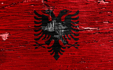 Flag of Albania on damaged wooden table