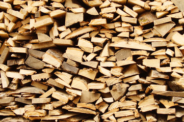 Chopped wood, stacked in a woodpile.