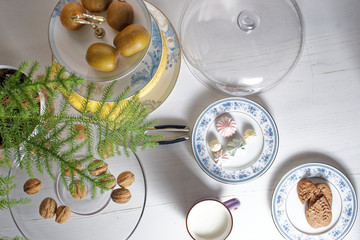 cup of milk and cake on wooden table