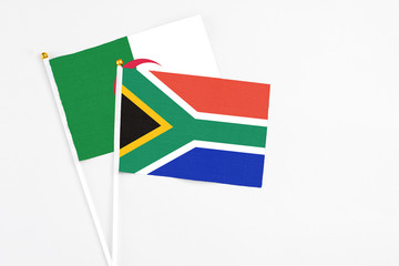 South Africa and Algeria stick flags on white background. High quality fabric, miniature national...