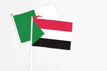Sudan and Algeria stick flags on white background. High quality fabric, miniature national flag....